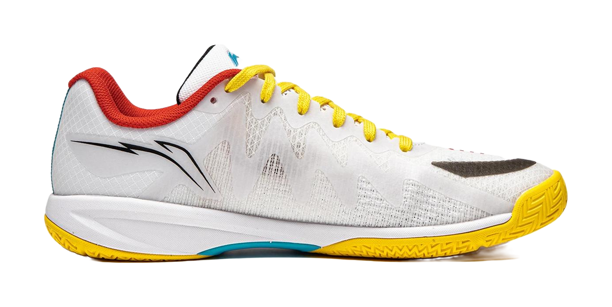 White table tennis shoe side view with yellow laces, red heel collar, teal details
