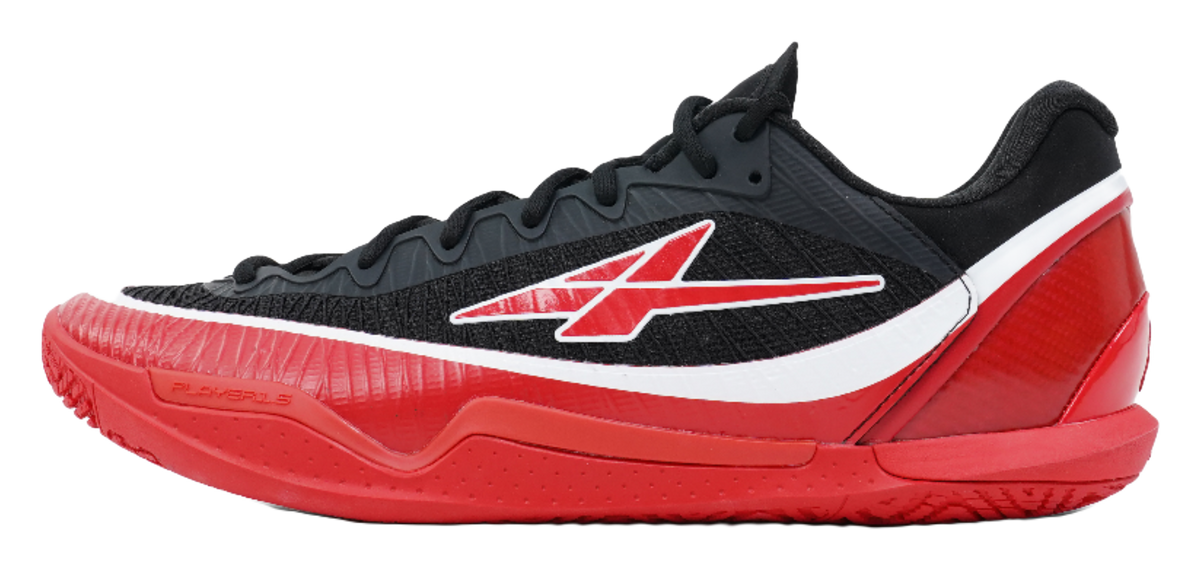 Low-top basketball shoe in black, red and white with grippy outsole
