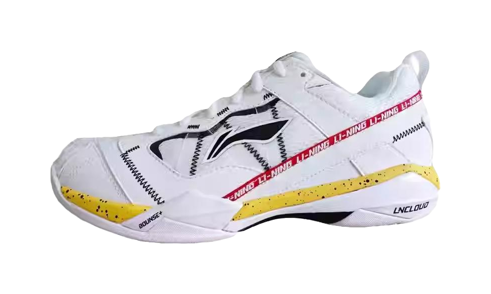 Men's white badminton shoe with black side stripes and yellow outsole accents