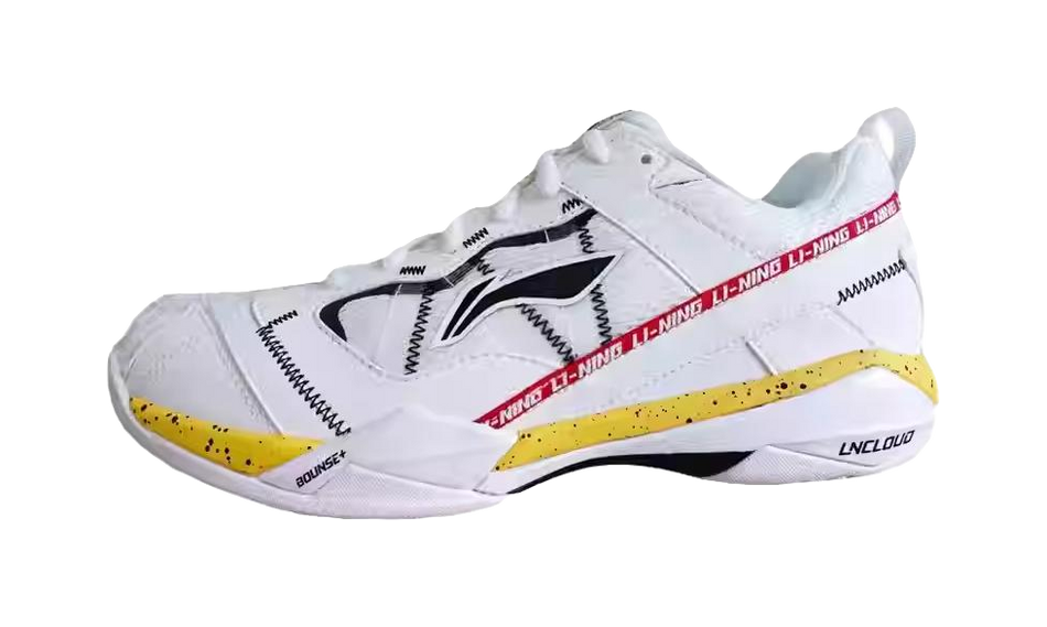 Men's white badminton shoe with black side stripes and yellow outsole accents