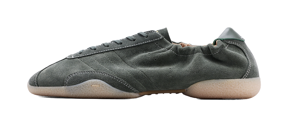 Dark green low-top sneakers with lace-up front and rubber sole
