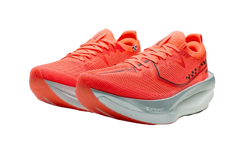Pair of women’s marathon racing shoes in orange with dark logo, thick light sole.