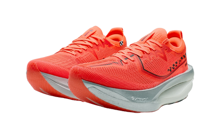 Pair of women’s marathon racing shoes in orange with dark logo, thick light sole.