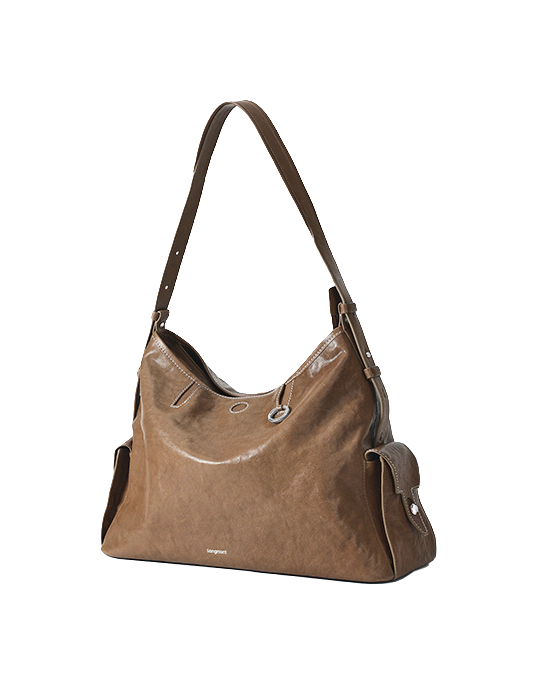 Tan leather hobo shoulder bag with top handle, crossbody strap, and side snap tab