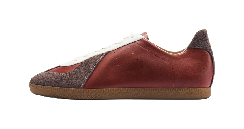 Low-top casual training shoe with burgundy leather upper and dark side panels, white toe trim