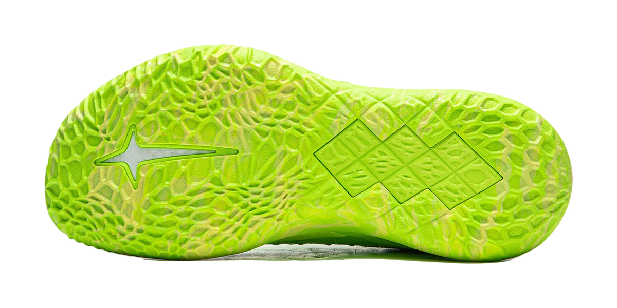 Green basketball shoe outsole with textured tread and side traction details