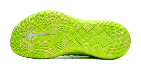 Green basketball shoe outsole with textured tread and side traction details