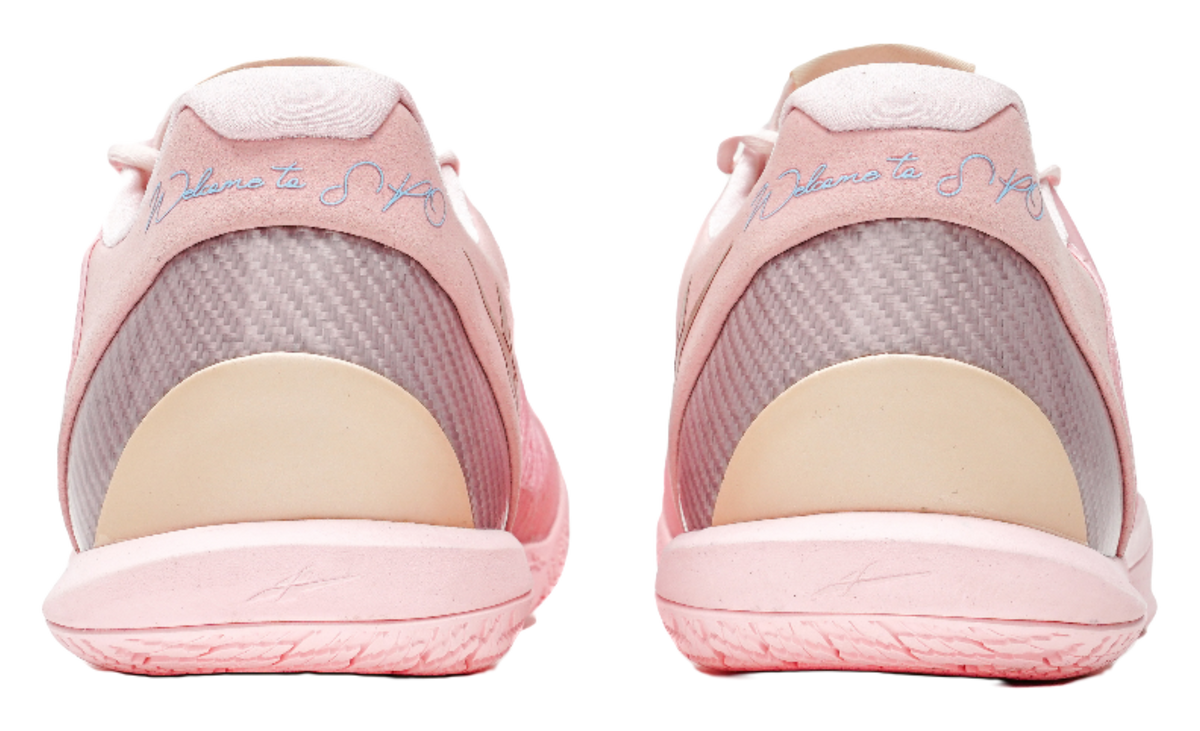 Pink low-cut basketball shoes with cushioned heel and breathable collar lining