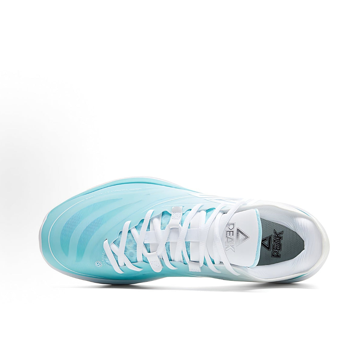 Ice blue and white low-top sneaker with lace-up closure and patterned toe panel.