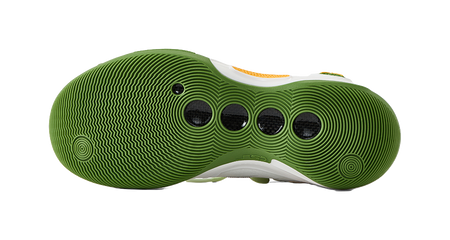 Green rubber outsole of low-top basketball shoes with circular traction pattern.