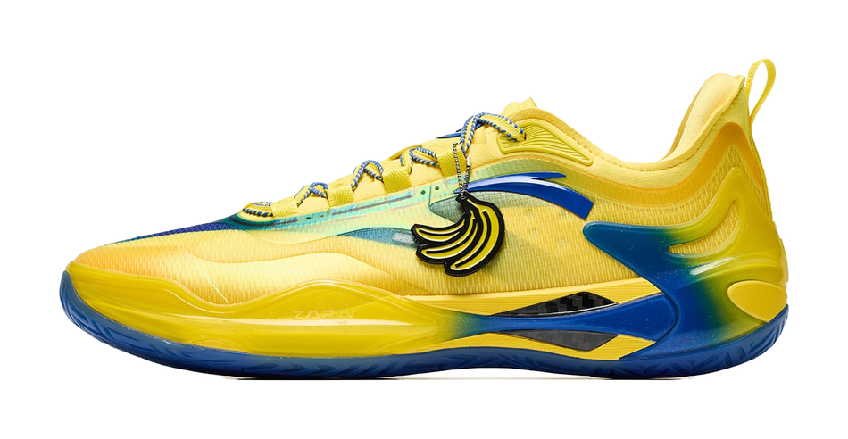 Unisex basketball shoe in yellow with blue accents, side cartoon graphic and lace-up