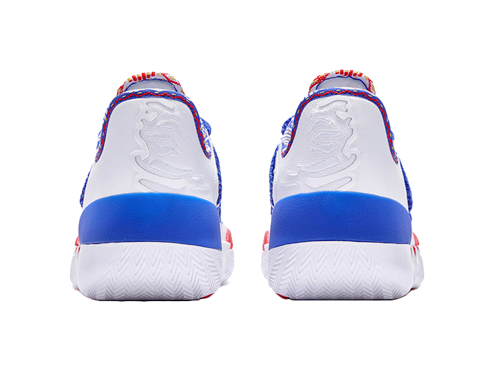 Rear view of white low-top basketball shoes with blue heel panels and textured outsole