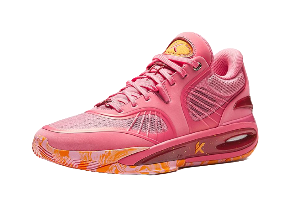 Pink low basketball shoe with lace-up front, padded collar, orange outsole