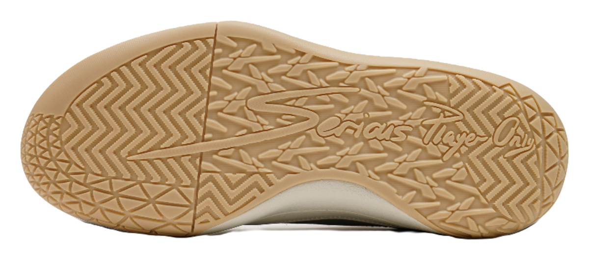 Unisex basketball shoe outsole in gum rubber with zigzag tread pattern