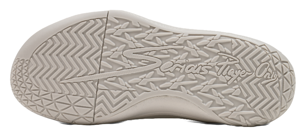Basketball shoe outsole with textured tread pattern on light gray rubber sole