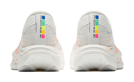 Pair of white running shoes with multicolor heel panel and textured outsole