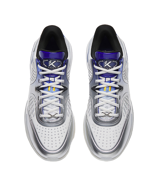 Pair of silver low basketball shoes, blue lace accents, logo on tongue