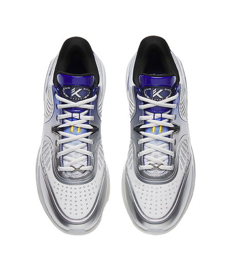 Pair of silver low basketball shoes, blue lace accents, logo on tongue