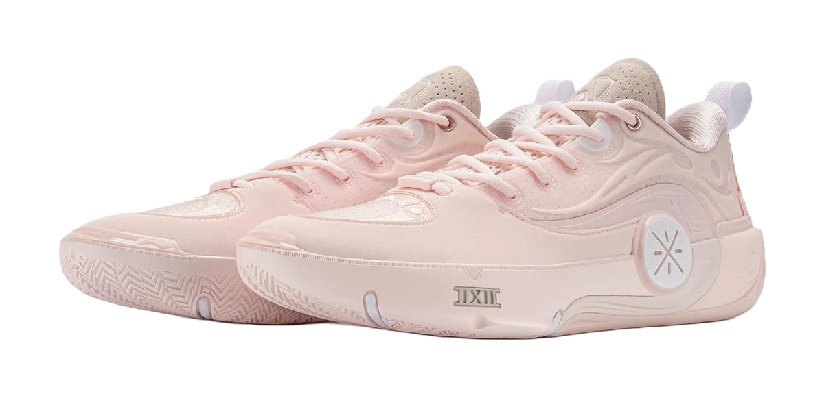 Two light pink basketball shoes, lace-up with textured side detailing and logo