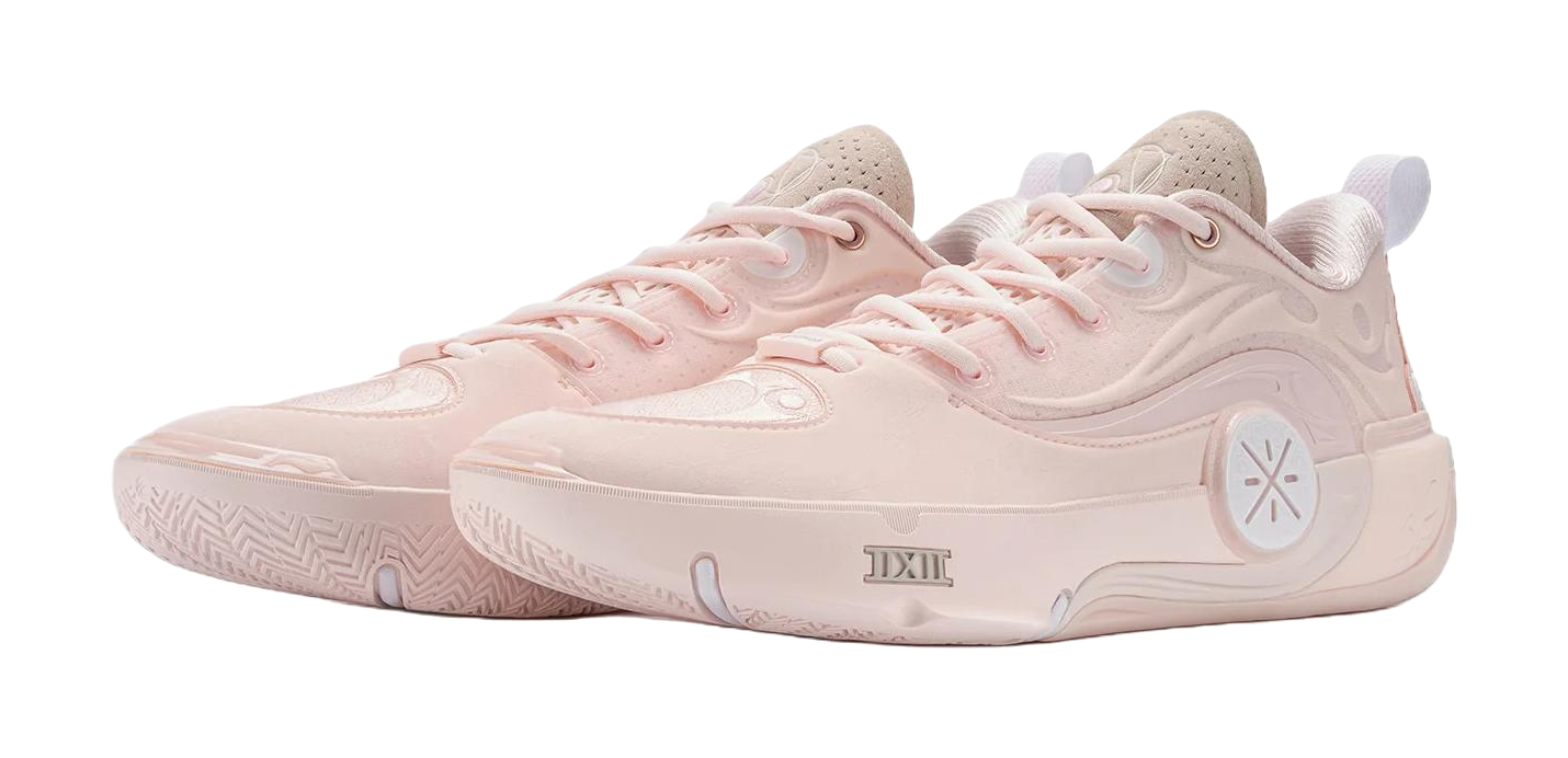 Two light pink basketball shoes, lace-up with textured side detailing and logo
