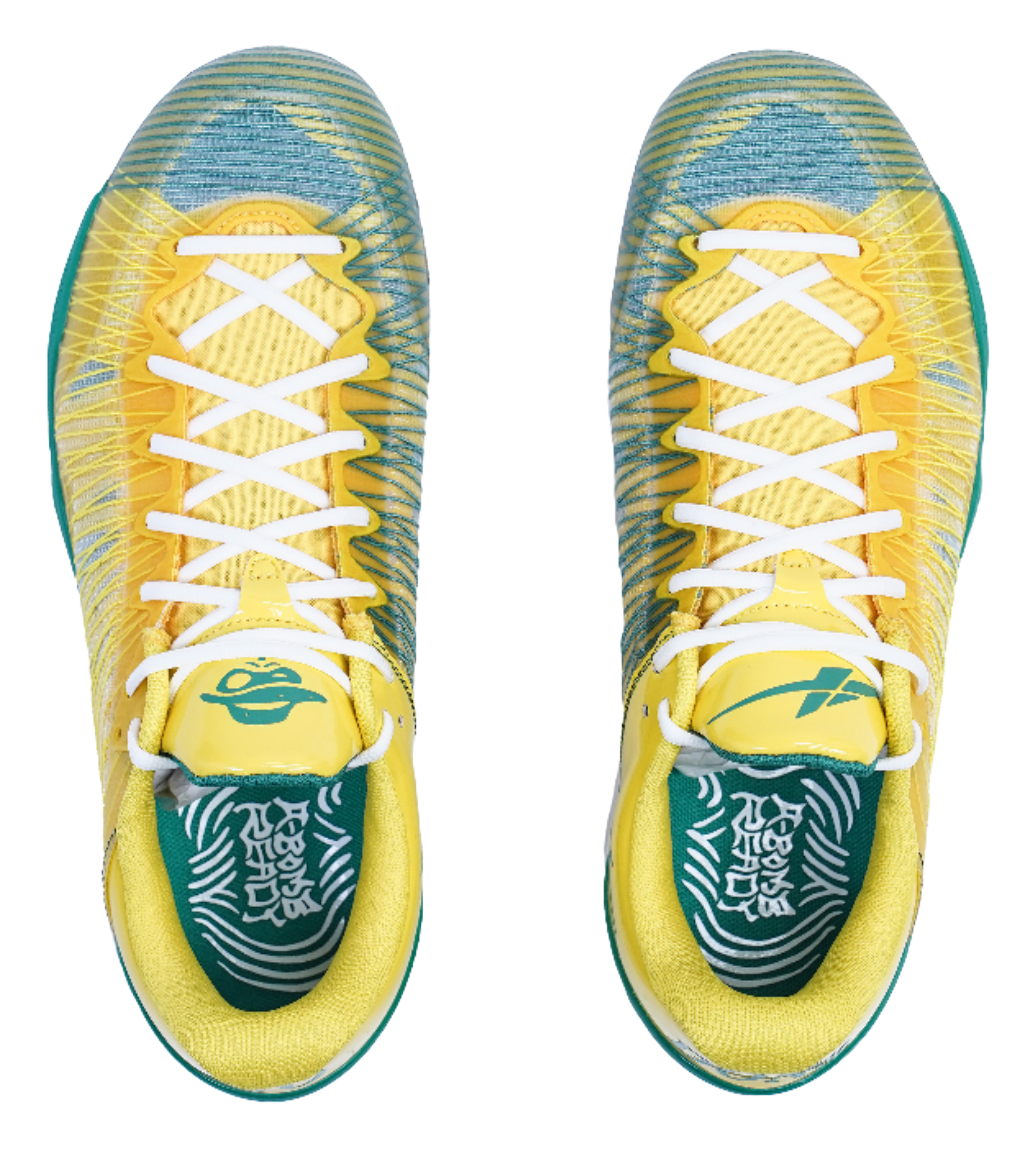 Front view of yellow sneakers with white crisscross laces and green patterned lining