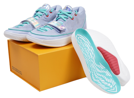 Light blue basketball shoes showing side profile with teal laces on white sole
