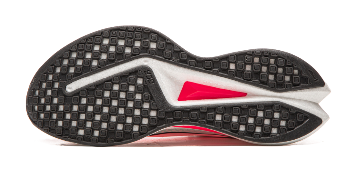 Running shoe outsole view with dark textured traction pattern and red midsole side accent