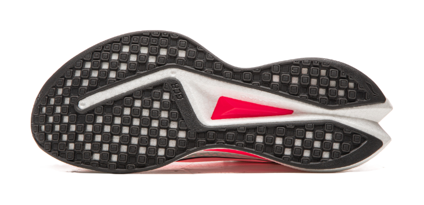 Running shoe outsole view with dark textured traction pattern and red midsole side accent