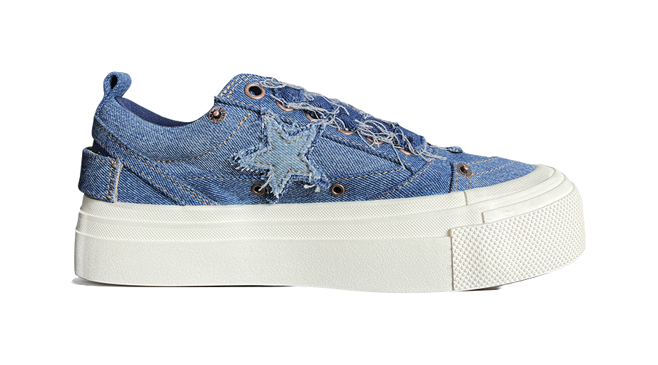 Blue denim low-top canvas sneaker, side view with star patches and white platform sole