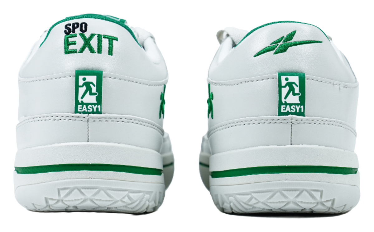 Back view of white low-top shoes with green heel tabs and striped midsole