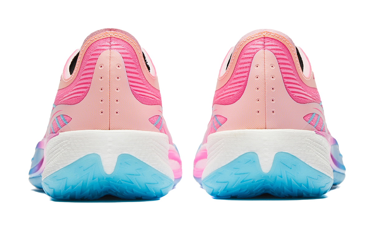 Back view of pink sneakers with cushioned white heel and blue rubber sole