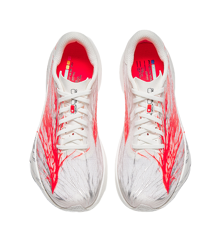Women's low-top running shoes pair view, white upper with red interior lining