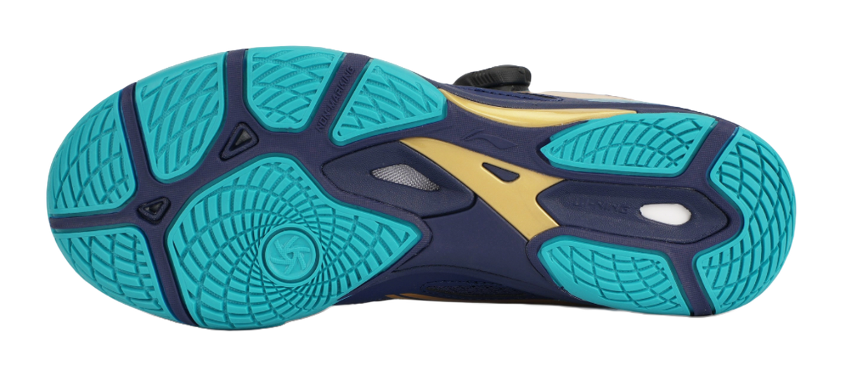 Table tennis shoe outsole in teal with textured traction pattern and dark blue trim