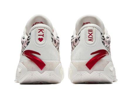 White basketball sneakers heel view with red logo and cushioned back tabs