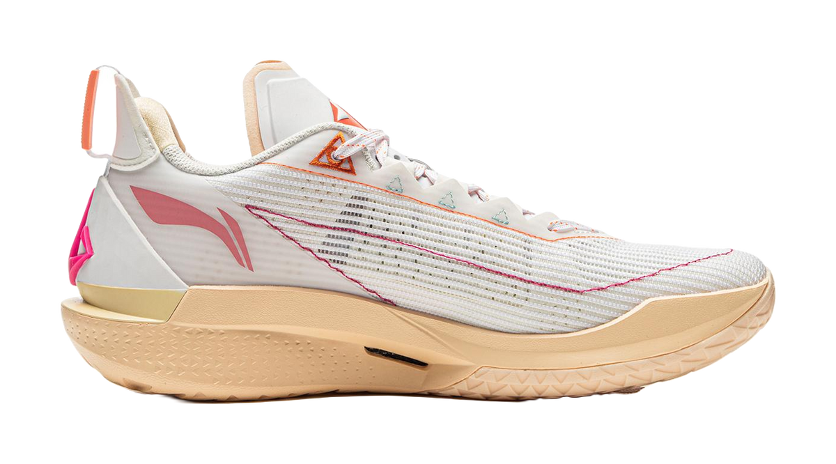 White/Orange basketball shoe with knit texture, side logo, and beige outsole