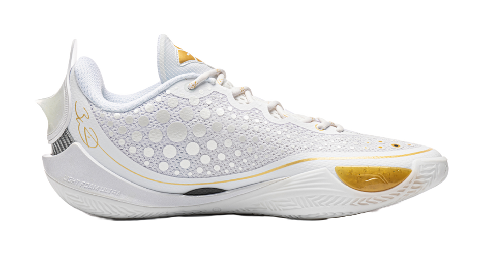 Low basketball shoe side view, perforated knit upper with gold-toe trim and white laces