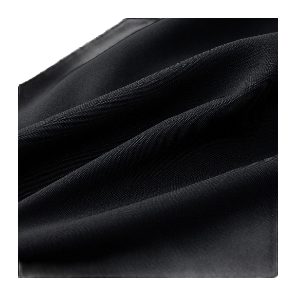 Black down puffer jacket fabric close-up with smooth quilted texture
