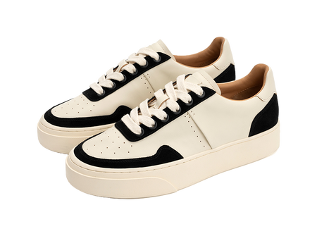 Low-top skate shoes, pair view, off-white canvas with black toe and side panels, laces.