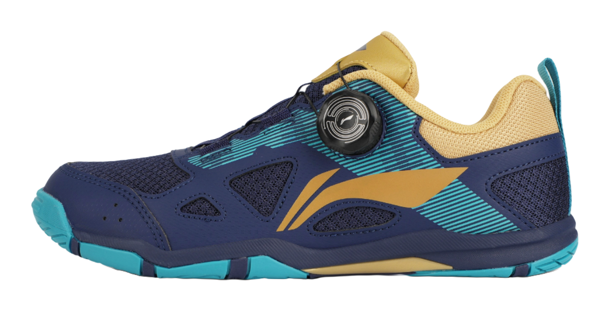Table tennis shoe in dark blue with gold accents and teal outsole detailing