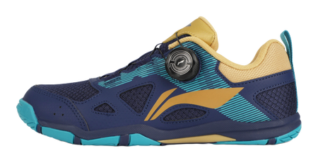 Table tennis shoe in dark blue with gold accents and teal outsole detailing