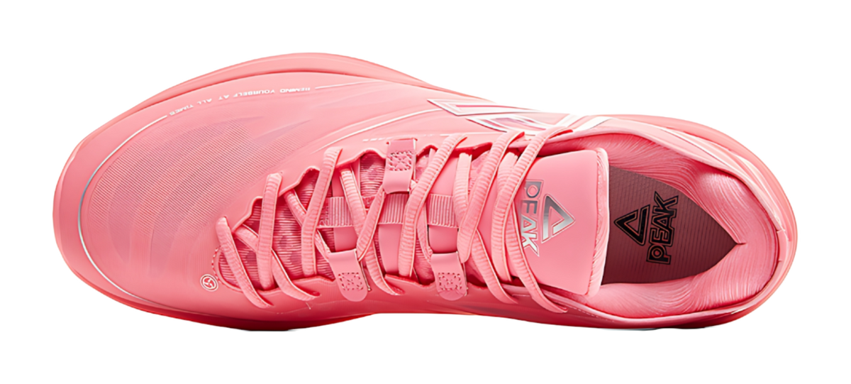 Red basketball shoe toe view with lace-up closure and padded tongue