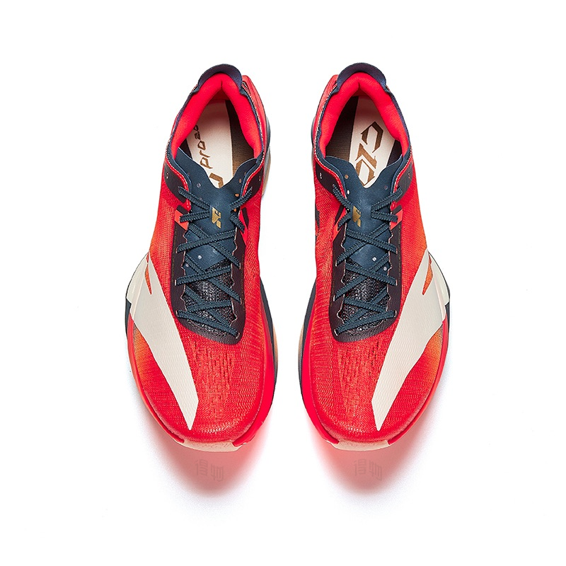 Women's running shoes, red upper with navy laces, white side stripe, red padded tongue