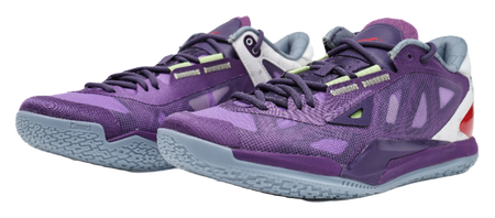 Purple lace-up basketball shoes with camo-like pattern, white heel, and red side cutout