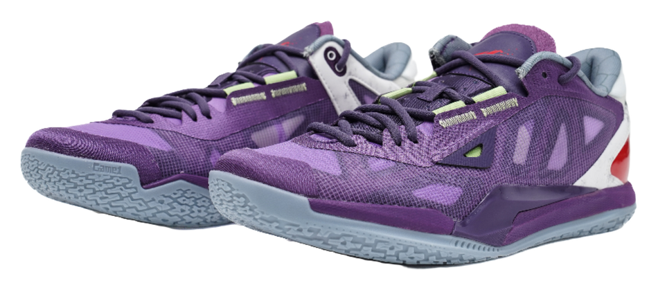 Purple lace-up basketball shoes with camo-like pattern, white heel, and red side cutout