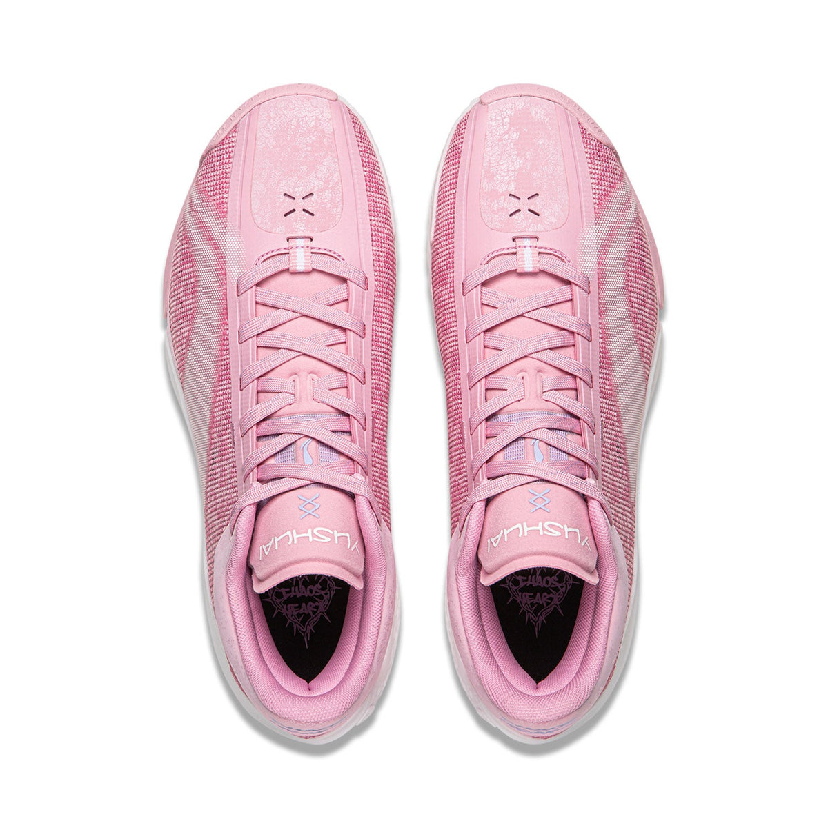 Pair of pink basketball shoes with lace-up tongues and black-lined interior