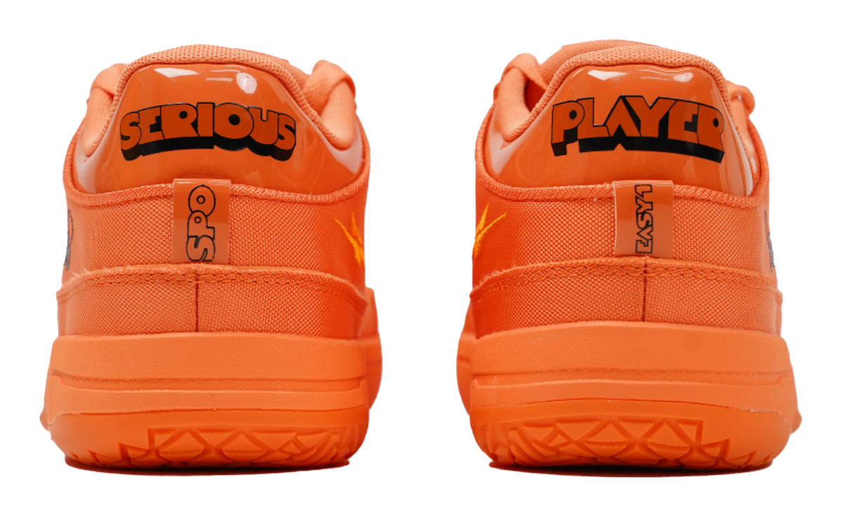 Orange basketball shoes with 'SERIOUS' and 'PLAYER' heel logos