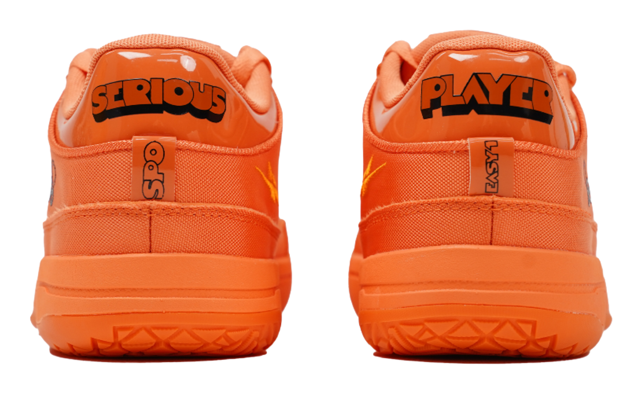 Orange basketball shoes with 'SERIOUS' and 'PLAYER' heel logos