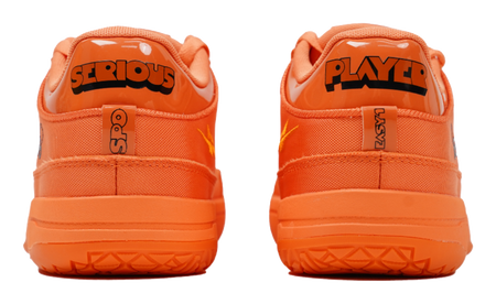 Orange basketball shoes with 'SERIOUS' and 'PLAYER' heel logos