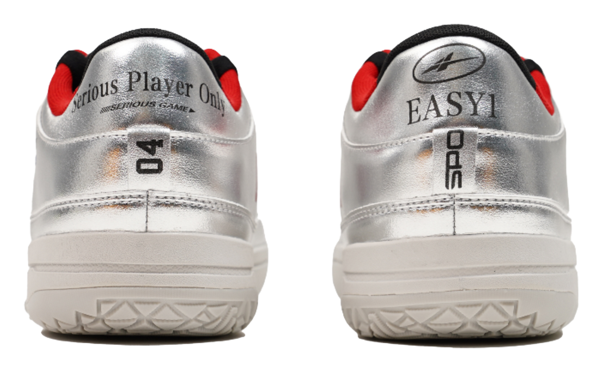 Silver basketball shoes heel view with red collar accents and thick tread sole
