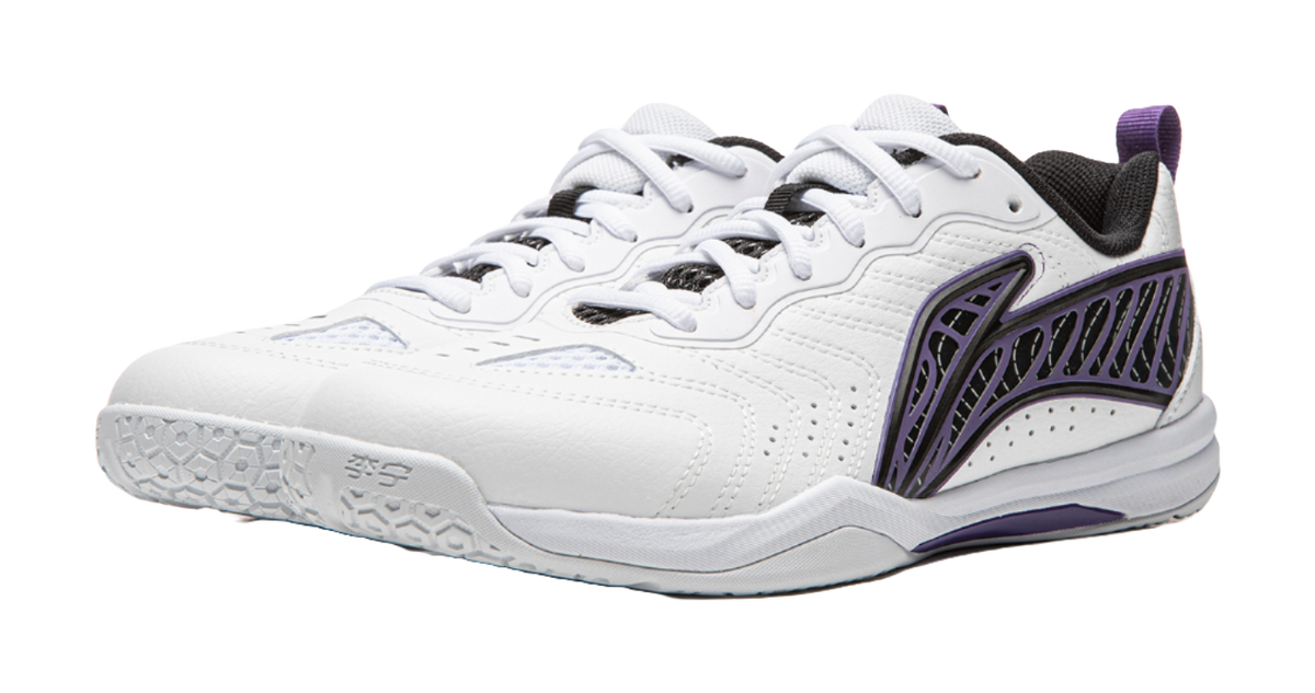 White table tennis shoe with purple side accents, perforated toe, and lace-up top
